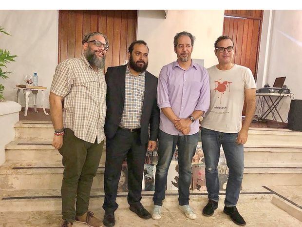 El escritor Luis Reynaldo Pérez, Mijail Peralta, gerente de Cultura Banreservas; el investigador musical Manuel Betances, y el escritor Miguel Yarull.
